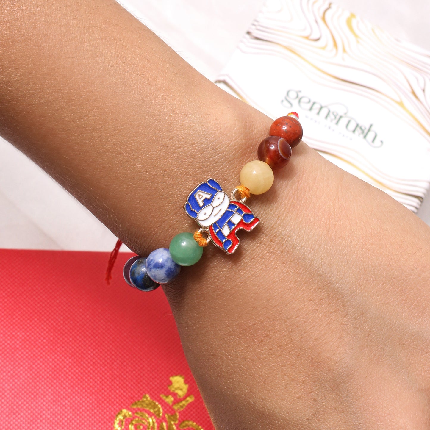 Gemstone Rakhi with Captain-Themed Superhero Charm – Fun & Protective Raksha Bandhan Bracelet for Kids