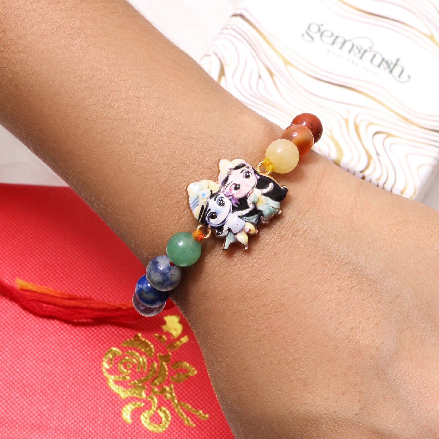 Colorful Natural Gemstone Rakhi with Krishna-Radha Cartoon Charm – Spiritual Raksha Bandhan Bracelet