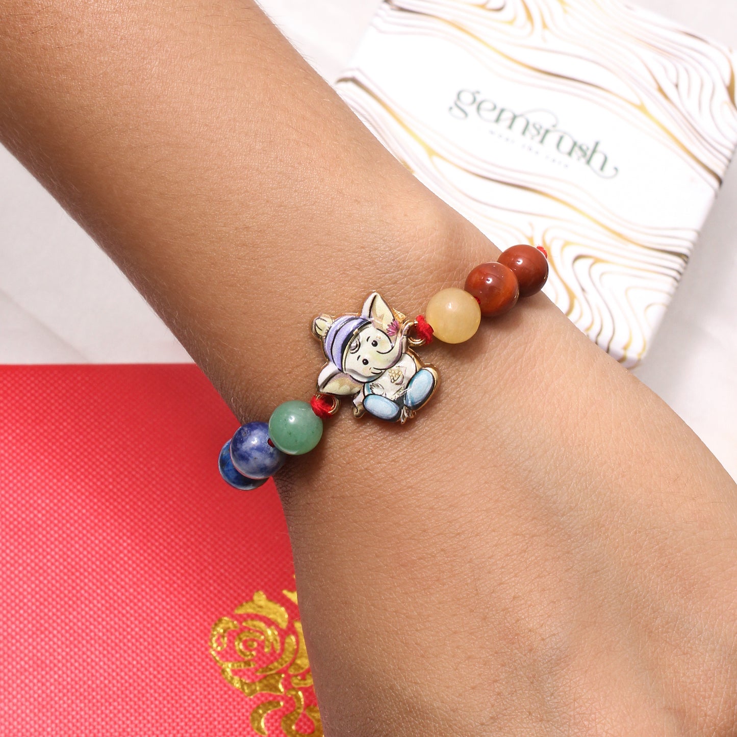 Colorful Gemstone Rakhi with Baby Ganesha Charm – Spiritual Raksha Bandhan Bracelet for Kids