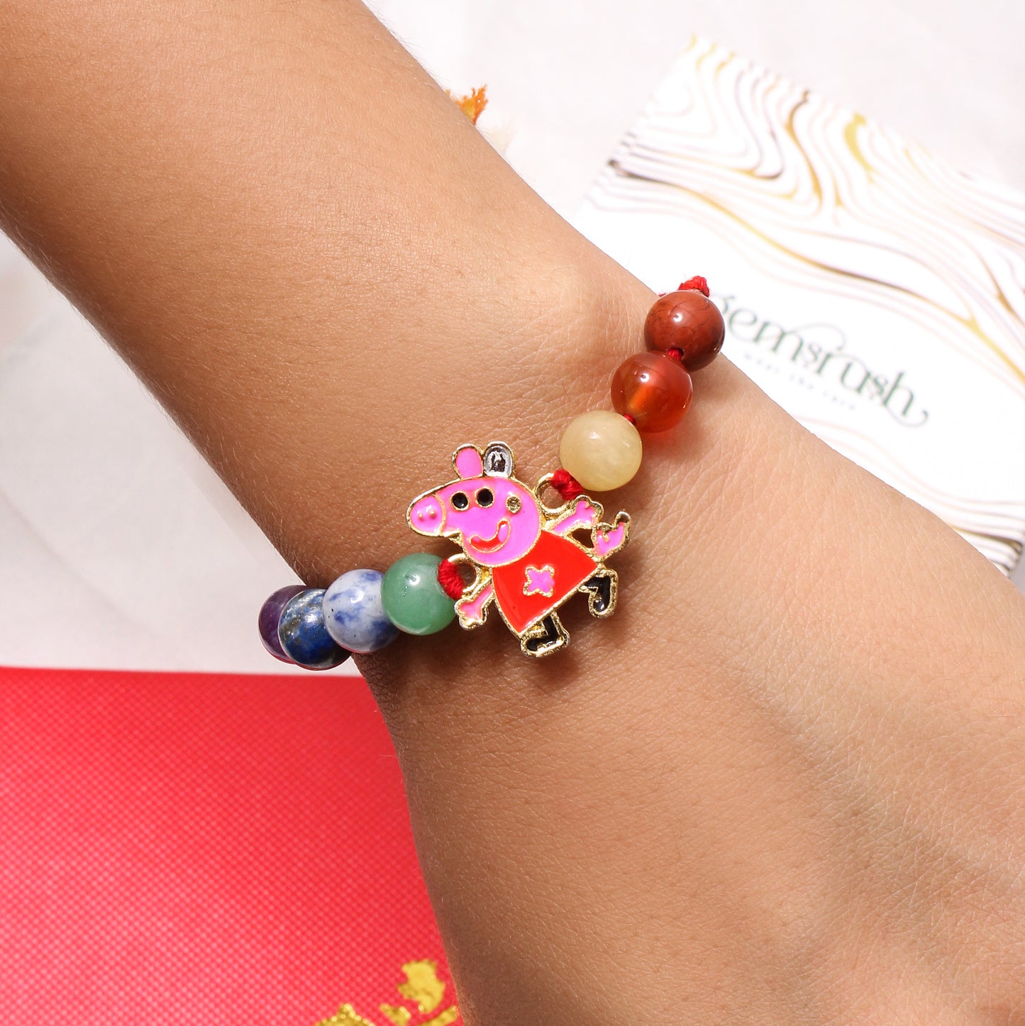 Colorful Natural Gemstone Rakhi with Peppa Pig Cartoon Charm – Fun & Healing Rakhi for Kids