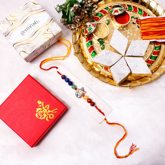 Colorful Gemstone Rakhi with Baby Ganesha Charm – Spiritual Raksha Bandhan Bracelet for Kids