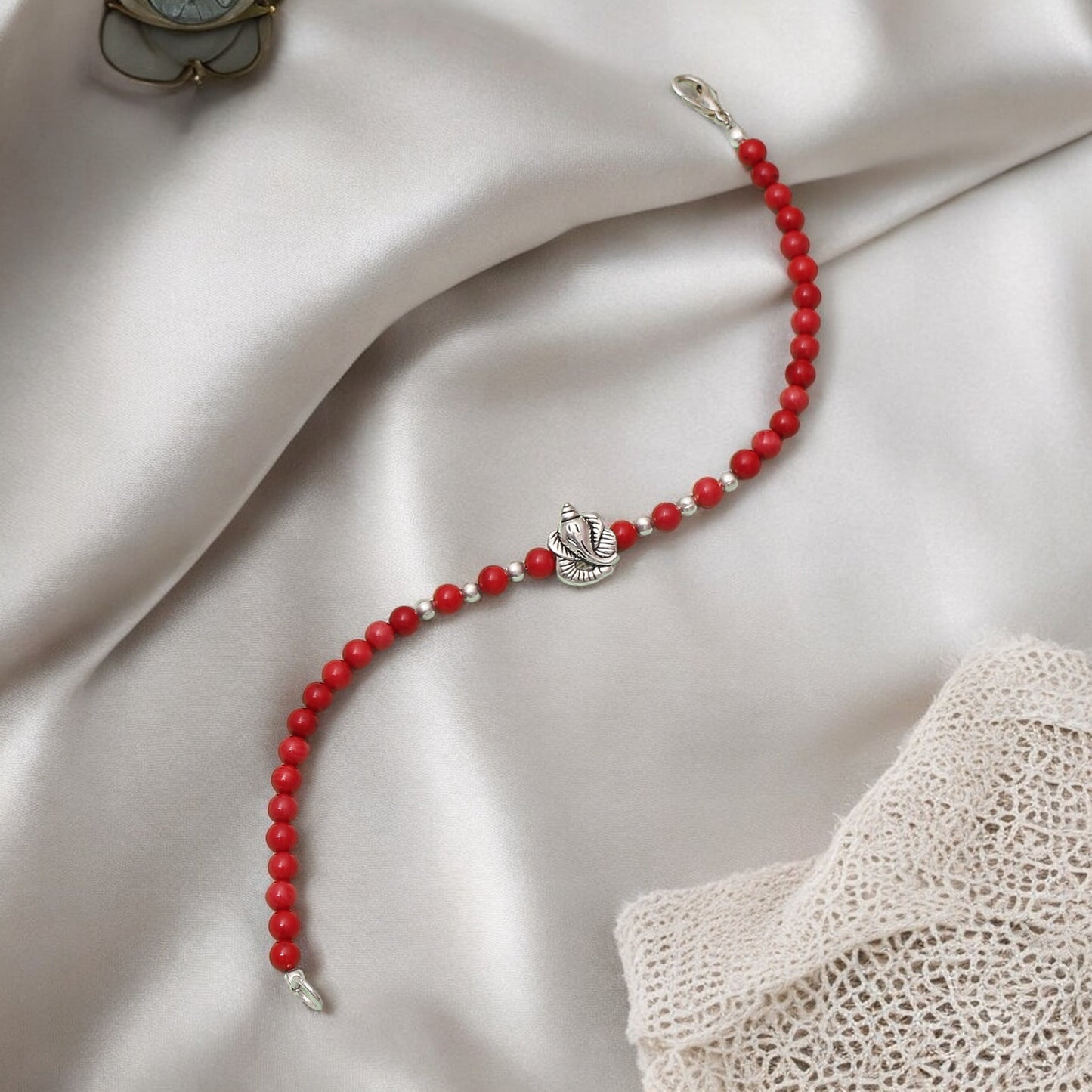 Coral Beaded Bracelet With Ganesha Charm