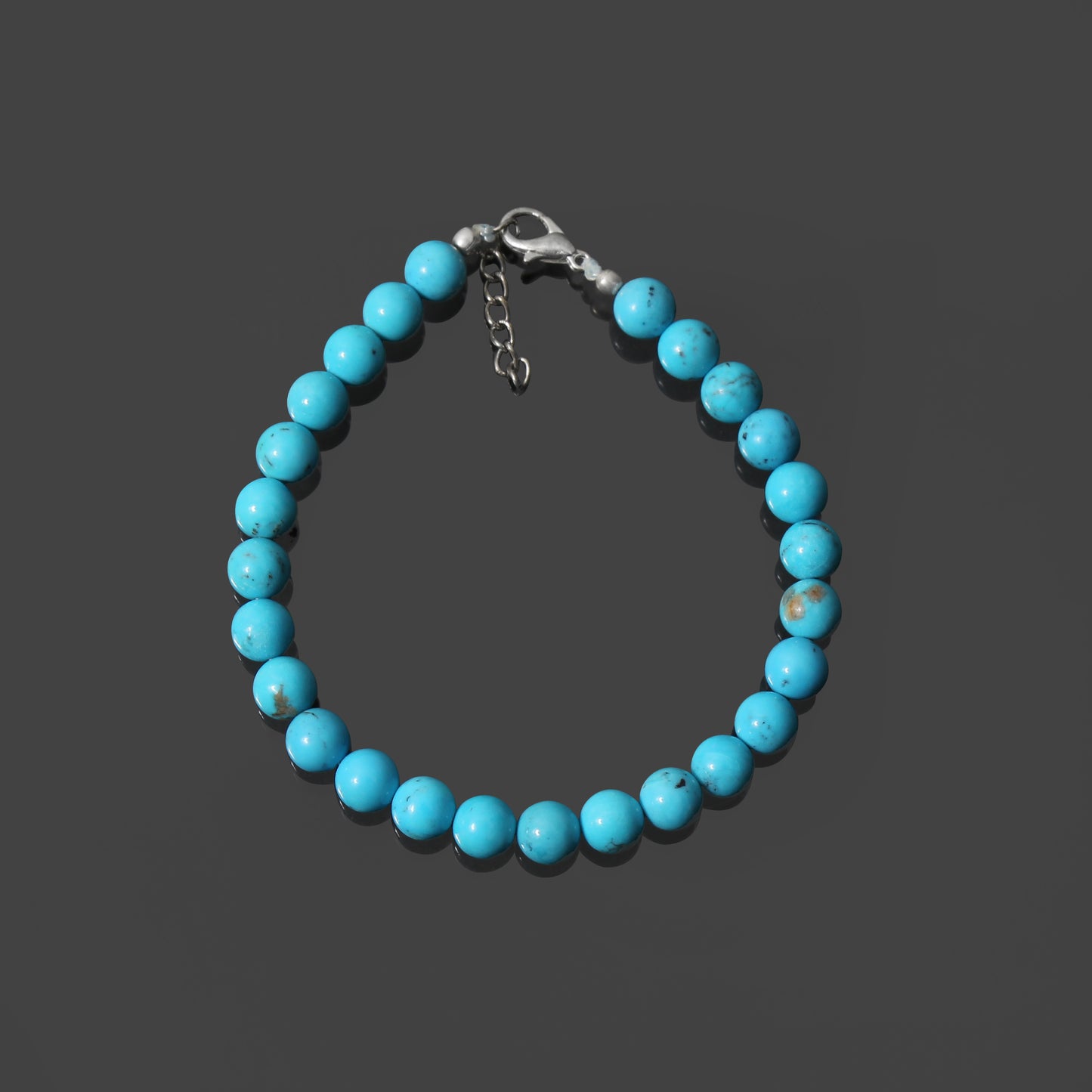 Tranquil Splendor: Turquoise Smooth Round 7mm Bracelet with Lobster Lock