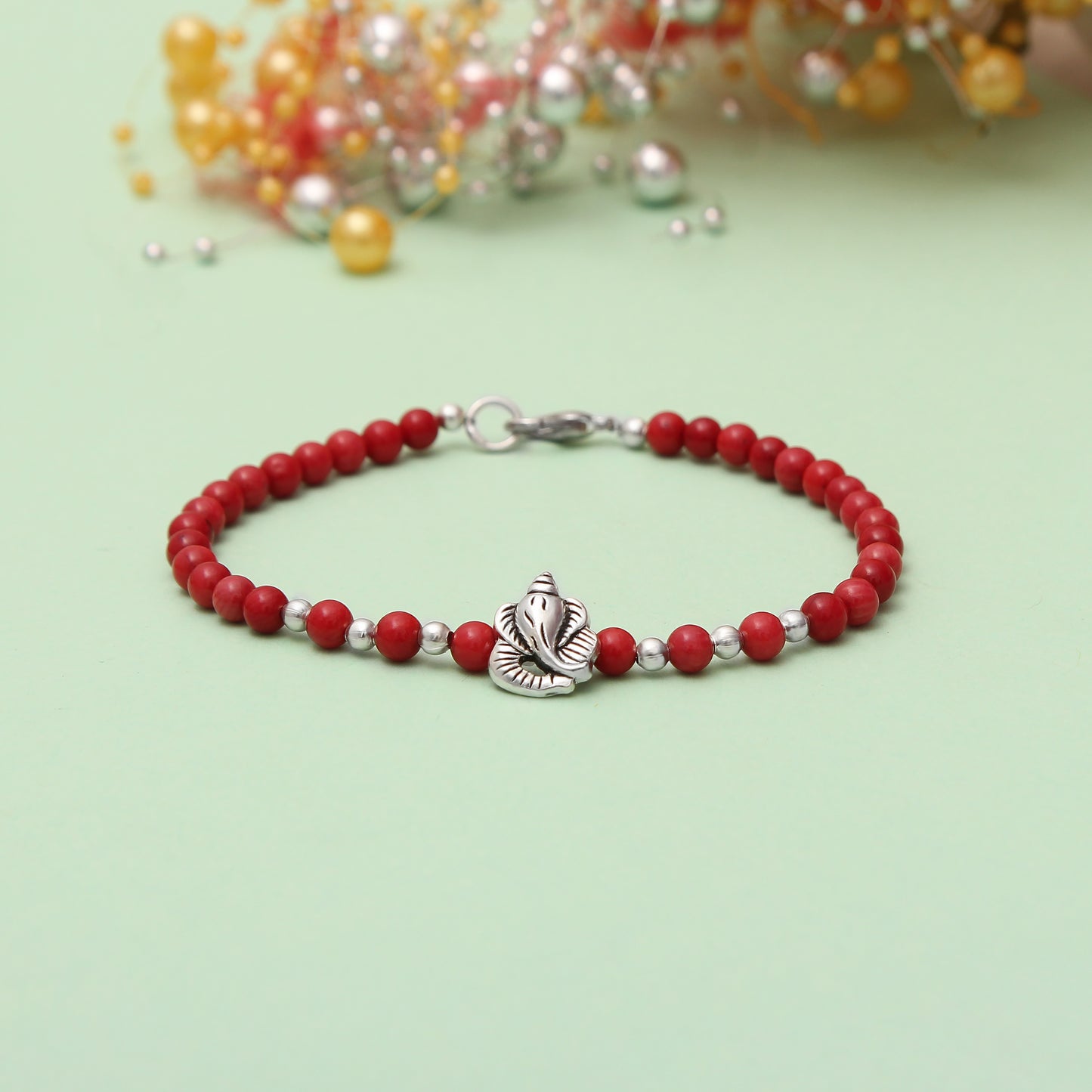 Coral Beaded Bracelet With Ganesha Charm