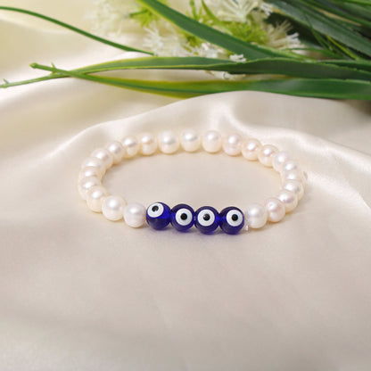 natural pearl and evil eye beaded stretch bracelet